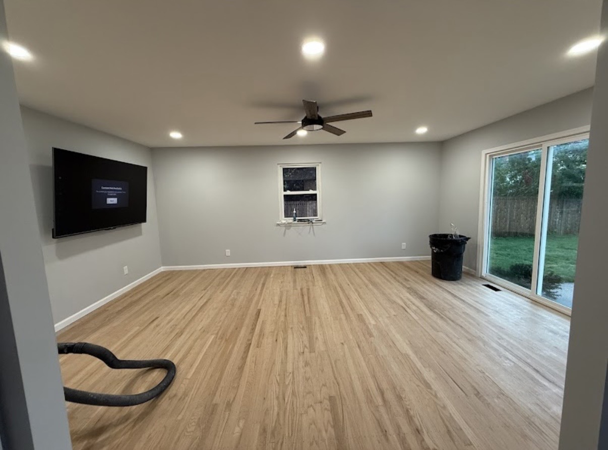 Renovated open living space with refinished red-oak hardwood floors